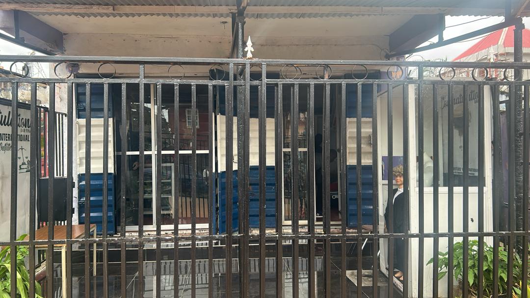 Barristers International store front with black metal gate